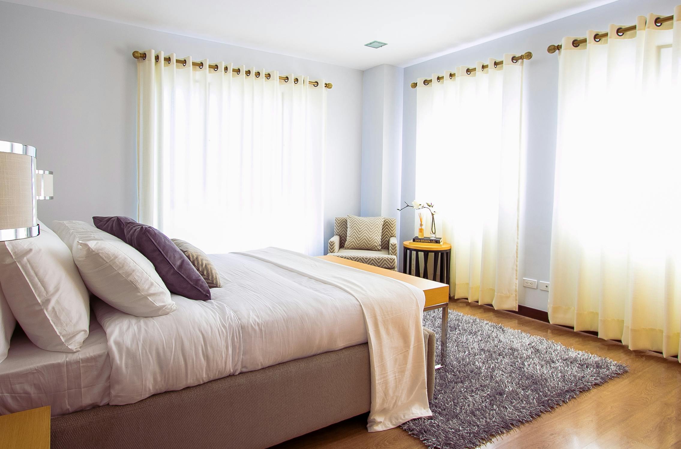 Bright bedroom with layered textiles